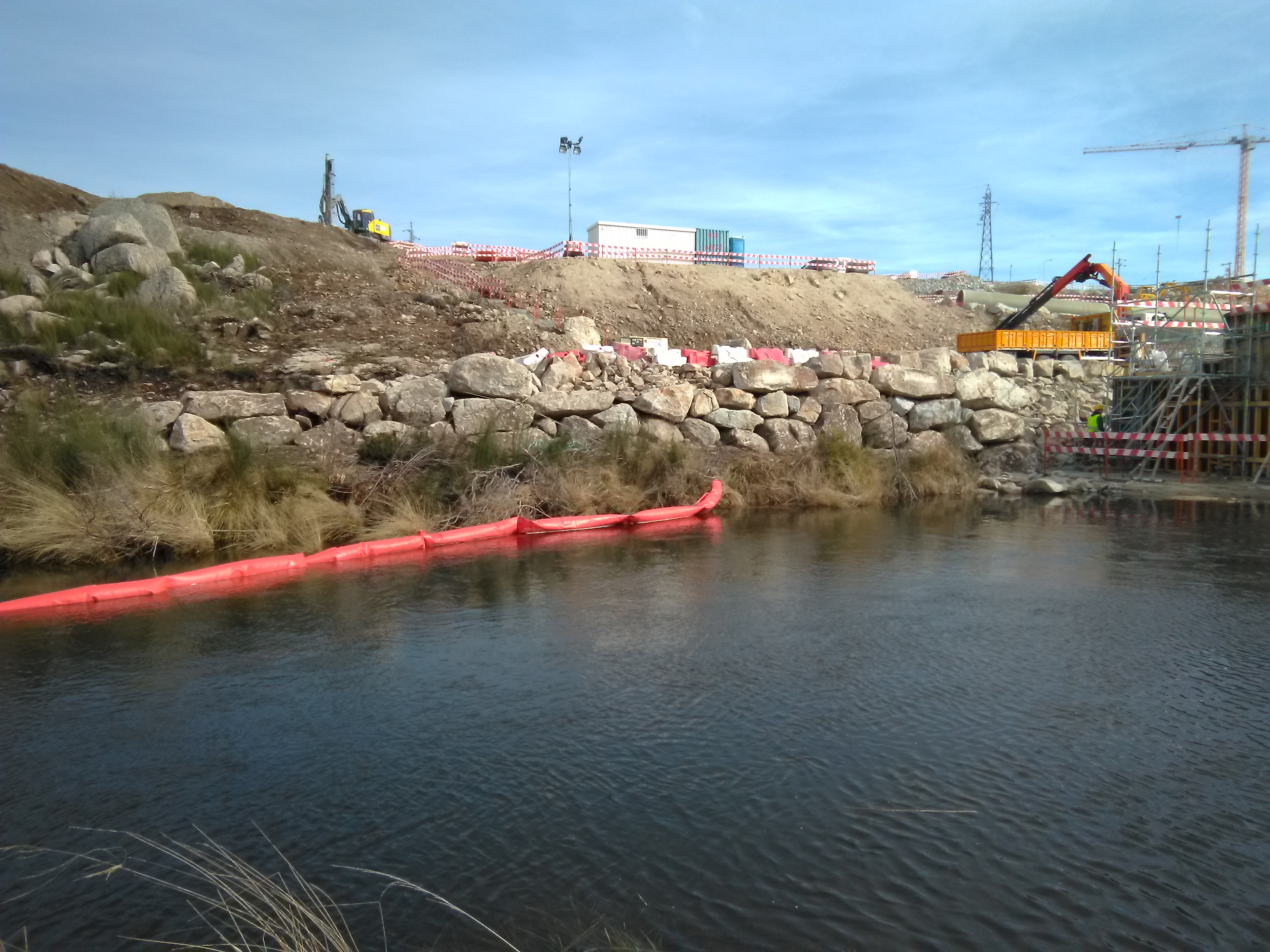 The geotextile barrier retains particulate matter around the worksite