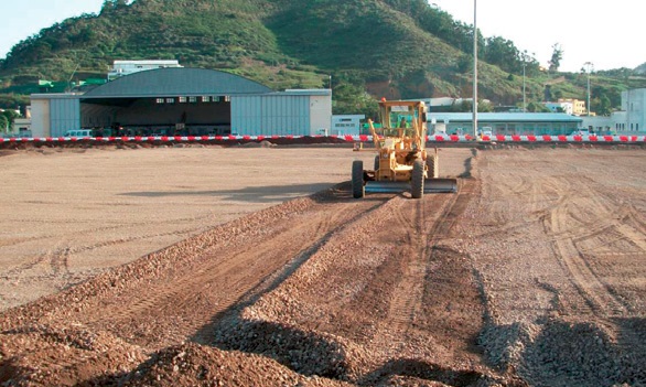 Spreading and levelling crushed concrete fill.