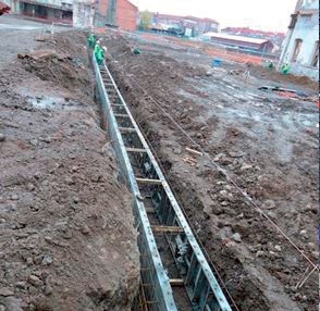 Building the guide wall with formwork on one side.