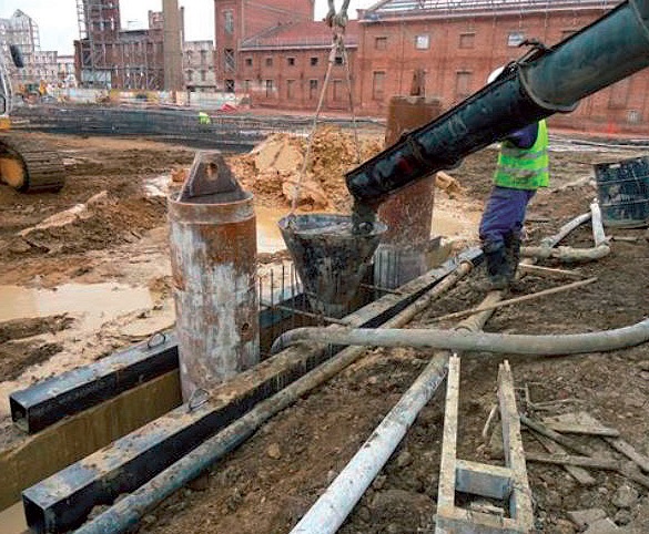 Placing the tubes before concreting the slurry wall.